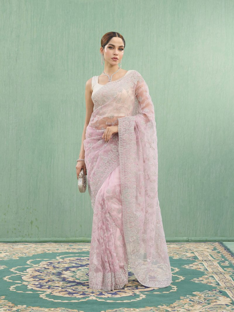 Gorgeous looking party wear tissue saree designed in vibrant pink color. This silk saree crafted with matching design work. Your perfect Eid attaire. This gorgeous masterpiece will make you "stand out" in the party.
